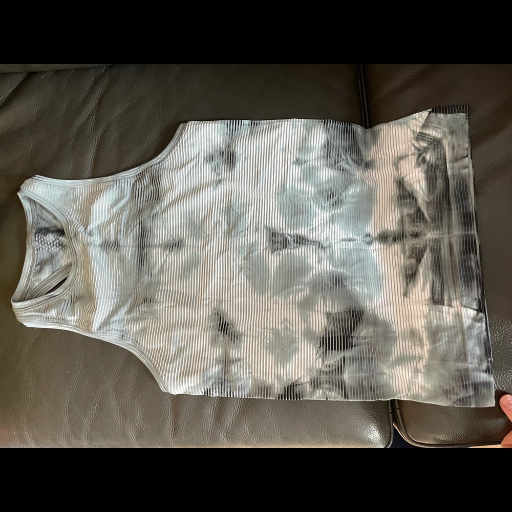 Run swiftly high neck tank top